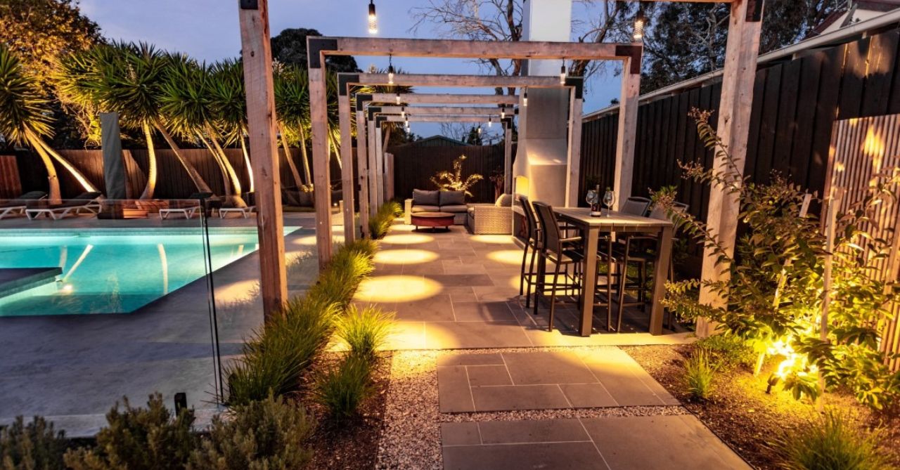 path and step lighting leading to pool at dusk